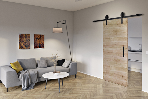 Posuvné dveře Corvara s povrchem Duradecor zavěšené na kolejnici v industriálním stylu